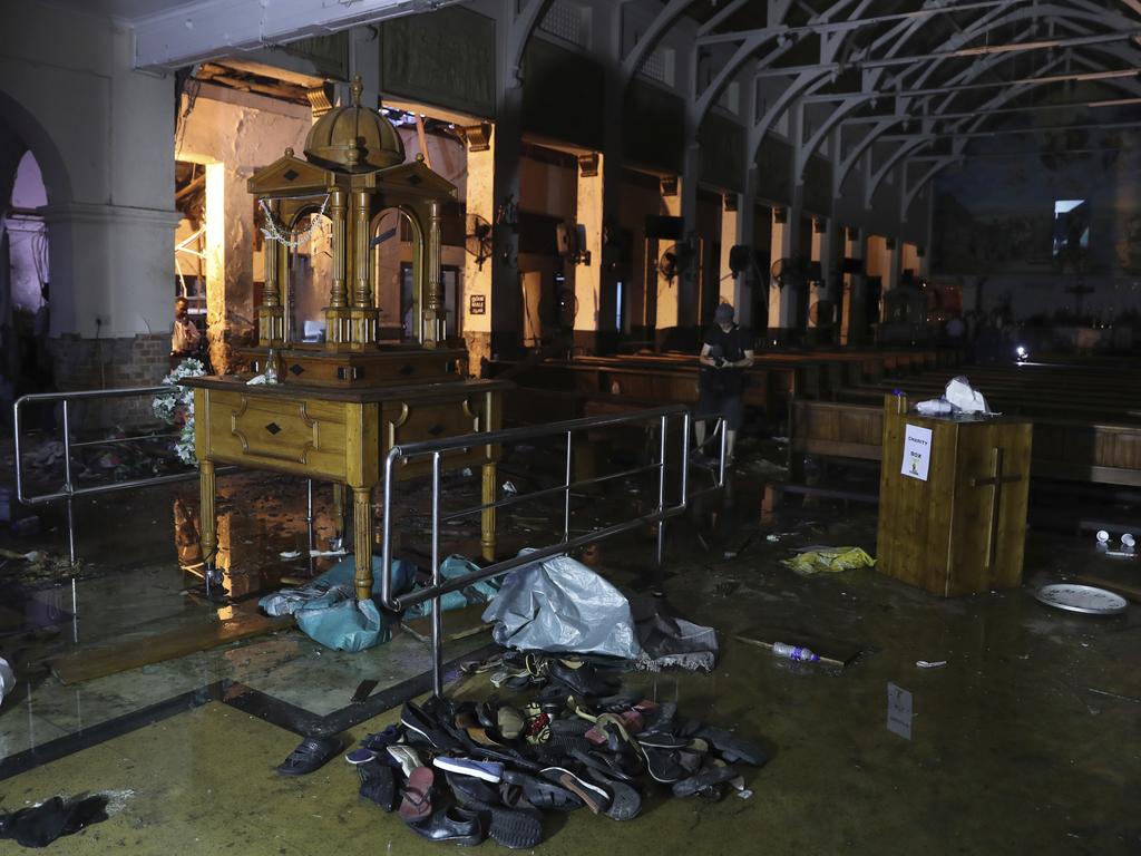 Shoes and other belongings of worshippers lie stacked up inside St. Anthony's Church in Colombo. Picture: AP