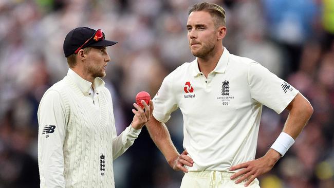 England's captain Joe Root (left) speaks to paceman Stuart Broad on the second day of the second Ashes cricket Test match against Australia in Adelaide. Photo: AFP