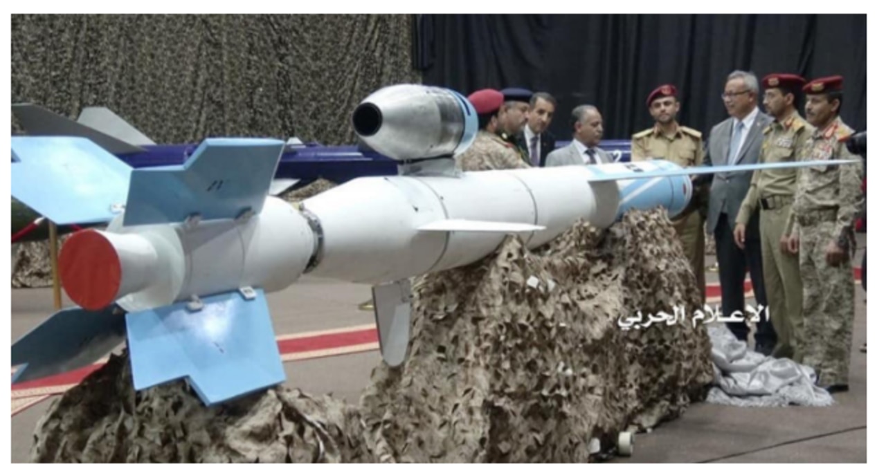 Yemeni Houthi officials stand around a Quds 1 (Jerusalem 1) cruise missile at a July event.