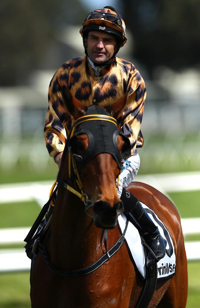 Jockey Dwayne Dunn returns to scale after riding No Effort to victory.