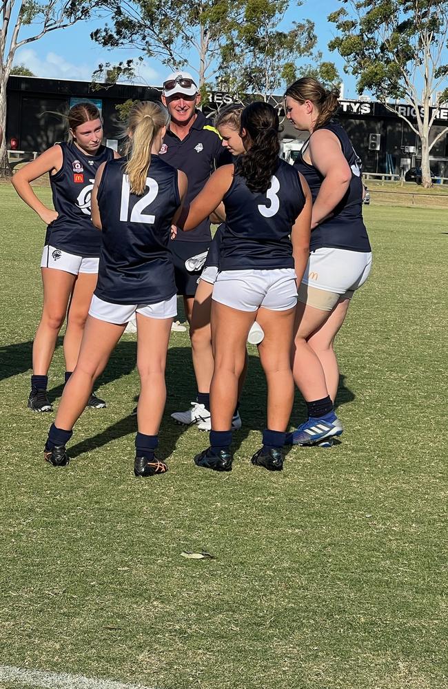 The Coorparoo girls get some quarter time instructions.