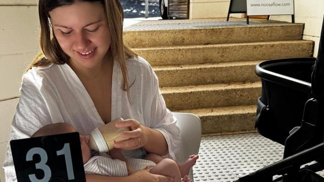 Ms Higgins nurses baby Frederick at a Noosa cafe over Easter. Picture: Instagram