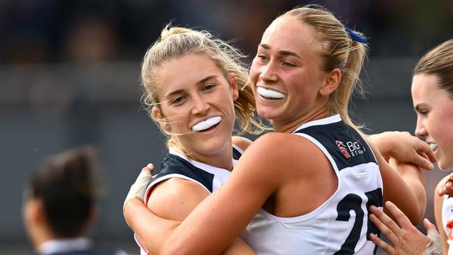 MELBOURNE, AUSTRALIA - OCTOBER 27: Keeley Sherar of the Blues is congratulated by team mates after kicking a goal during the round nine AFLW match between Collingwood Magpies and Carlton Blues at Victoria Park, on October 27, 2024, in Melbourne, Australia. (Photo by Quinn Rooney/Getty Images)