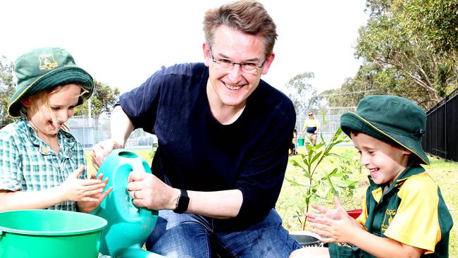 Community spirit will be celebrated. Here Jon Dee plants trees with Michelle Carmichael and Blake Kruger. Picture: Renae Droop