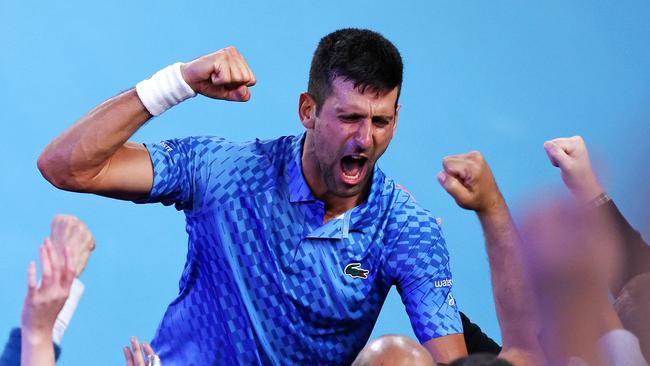 Novak Djokovic celebrates with his family and coaching staff. Picture: Mark Stewart