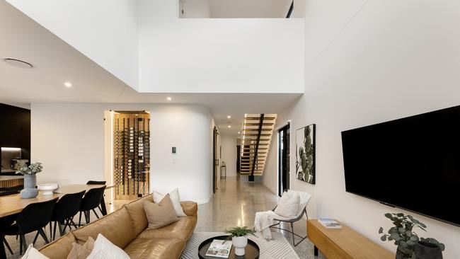 A large void adds a feeling of spaciousness across the home’s main living zone.