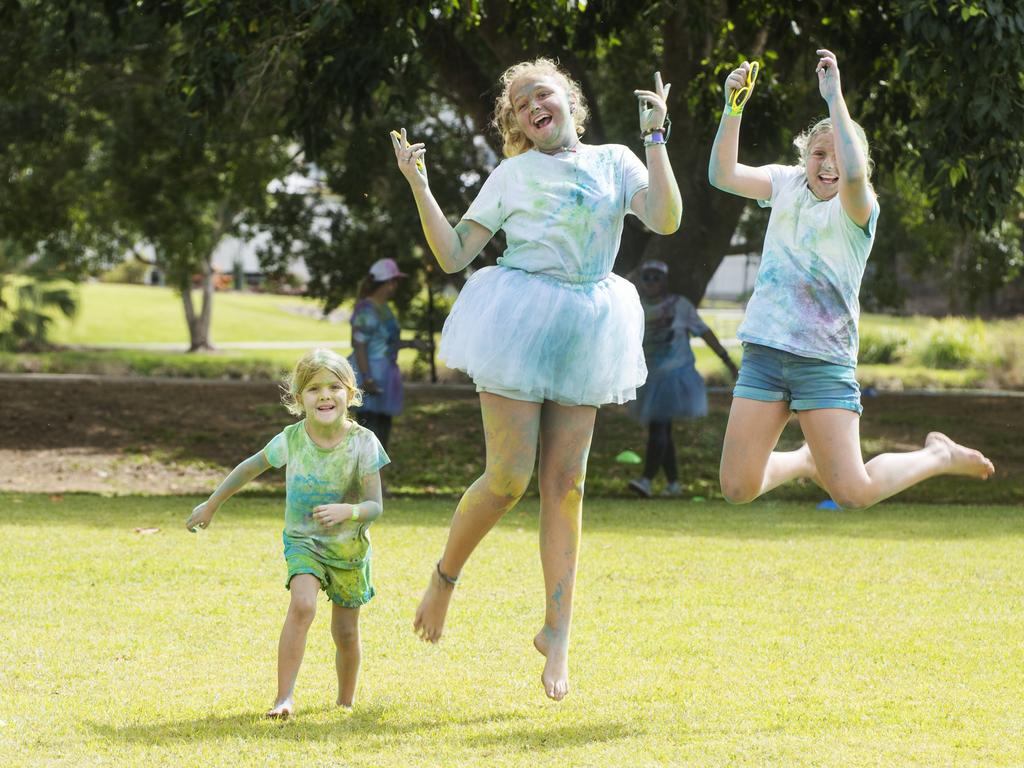 Holly Glover, Ella Glover and Alyssa Glover from Blacks Beach at the Mackay Colour Run 2021. Picture: Michaela Harlow