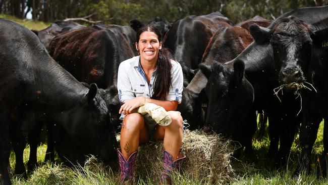 Australian women's Rugby Sevens star Charlotte Caslick spends some time recuperating from a hand injury on her farm at Stanthorpe. Picture: Adam Head