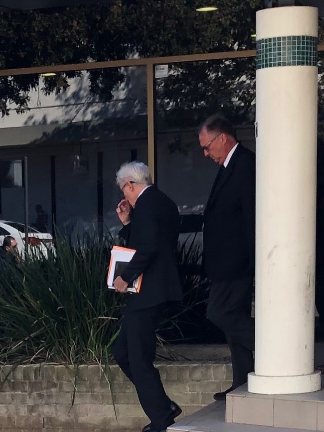 Ronald Peters with his lawyer as they leave Fairfield Local Court.