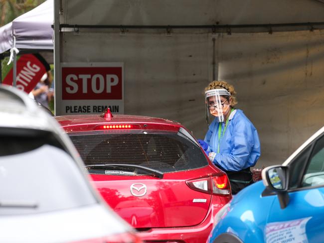 SYDNEY, AUSTRALIA - NewsWire Photos, DECEMBER 22 2021: Health professionals are seen working at the Willoughby Drive through testing clinic as testing demand surges ahead of the holidays in Sydney. Picture: NCA Newswire / Gaye Gerard