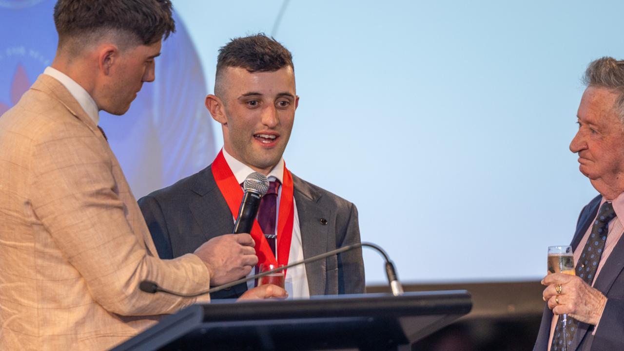 Jake Toeroek (middle) is awarded the John Letts Medal on Saturday night. Picture: Makoto Kaneko