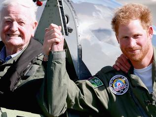 CHICHESTER, ENGLAND - SEPTEMBER 15: Prince Harry poses next to 95 year old Battle of Britain Veteran Tom Neil after he landed back at Goodwood Aerodrome in his Spitfire after a Battle of Britain Flypast on September 15, 2015 in Chichester, England. The 75th Anniversary of the Battle of Britain is being marked by a historic flypast that brings more Battle of Britain aircraft together than ever before as a show of thanks to 'the few' and the sacrifices they made. (Photo by Chris Jackson/Getty Images)