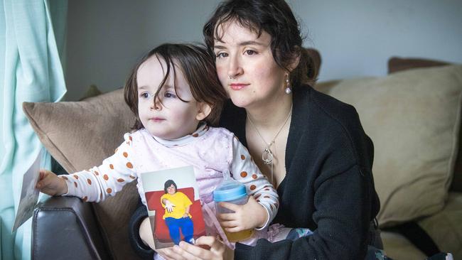 Veronica South and her two year old daughter Meia South holds a photo of her mother Colleen South. Picture: Mark Brake