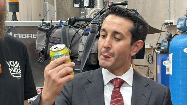 QLD Premier David Crisafulli taste tests a beer fresh off the Your Mates brewery production line.