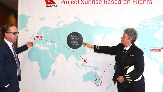 Qantas CEO Alan Joyce and Captain Lisa Norman discuss research flight plans in Sydney in August last year. Picture: Getty Images