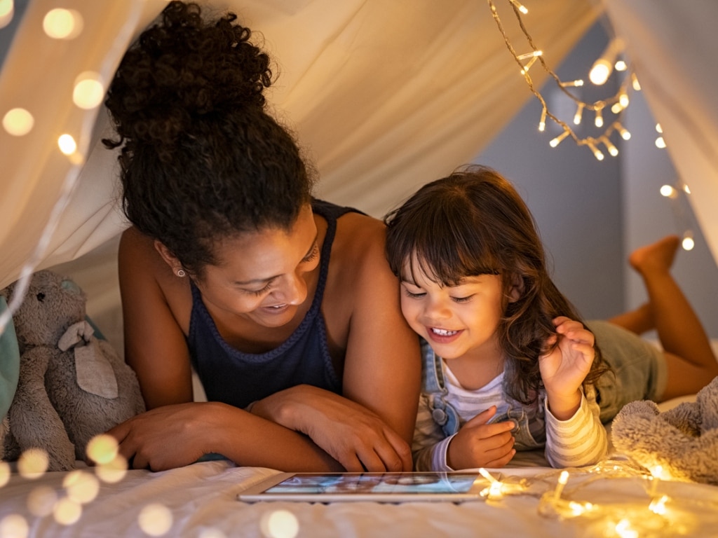 Mum with daughter browsing a tablet