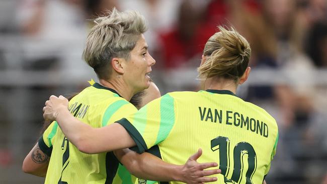 GLENDALE, ARIZONA - FEBRUARY 23: Michelle Heyman #2 of Australia celebrates with Emily van Egmond #10 after scoring a goal against the United States during the second half of the 2025 SheBelieves Cup match at State Farm Stadium on February 23, 2025 in Glendale, Arizona. (Photo by Chris Coduto/Getty Images)