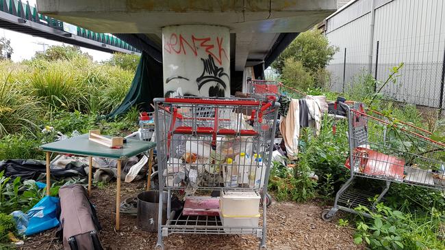 Trolleys and rubbish dumped underneath the Ringwood gateway bridge on the EastLink trail. Picture: Kiel Egging.