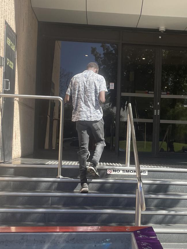 Tut Choul Bol entering the Alice Springs Local Court.