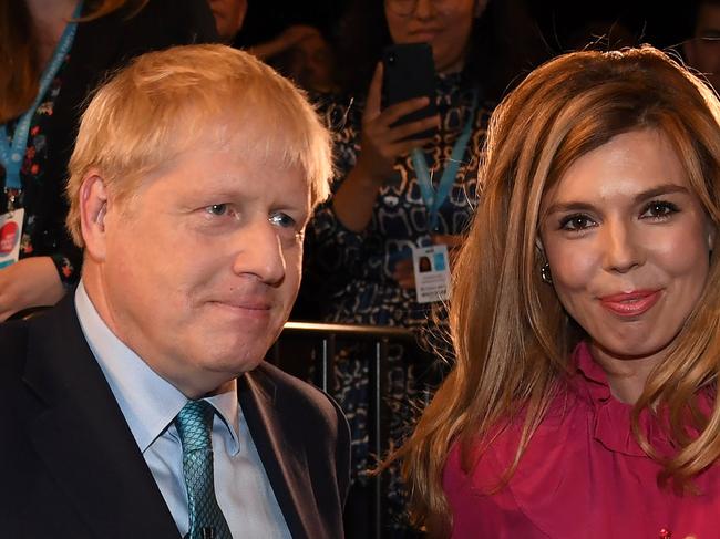 Boris Johnson and Carrie Symonds are back living together at Downing Street after their health battles. Picture: AFP