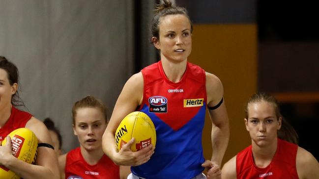 Daisy Pearce runs onto the field during the field. Photo by Michael Willson/AFL Photos via Getty Images.