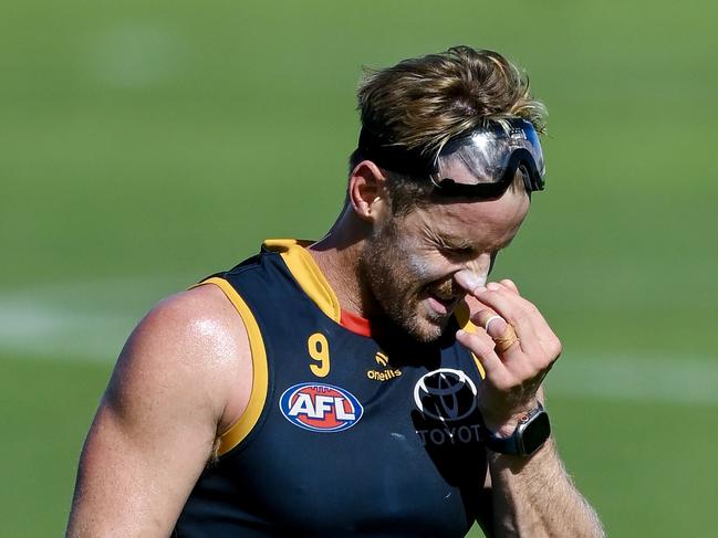 ADELAIDE, AUSTRALIA - MARCH 08: Rory Sloane of the Crows wipes the sweat out his eyes from wearing ski goggles  during an Adelaide Crows AFL training session at West Lakes on March 08, 2024 in Adelaide, Australia. (Photo by Mark Brake/Getty Images)