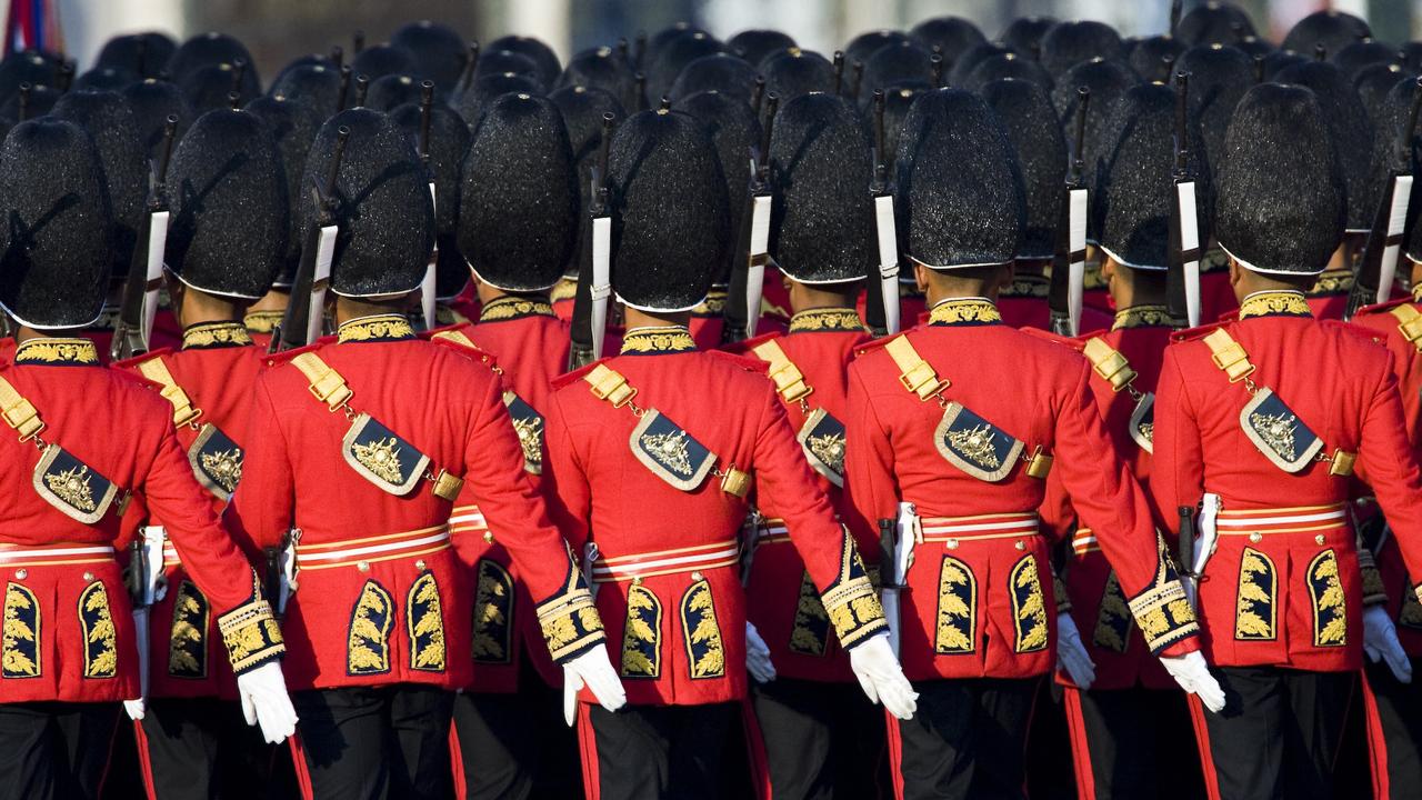 Thai soldiers with the King's Guard march in review during trooping of the colours ceremonies in Thailand. Picture: AP Photo/David Longstreath