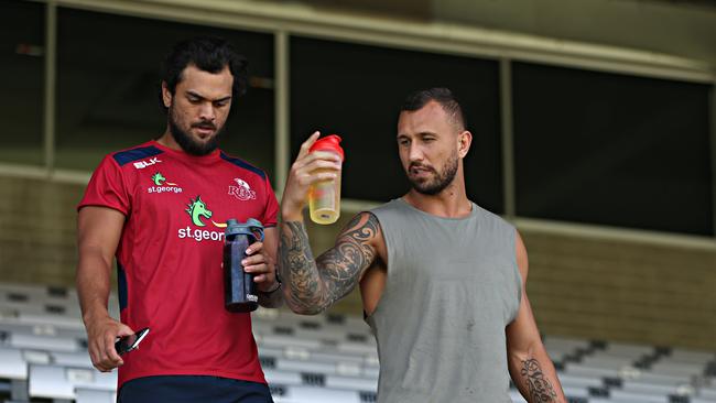 Karmichael Hunt and Quade Cooper of the Reds at Ballymore.