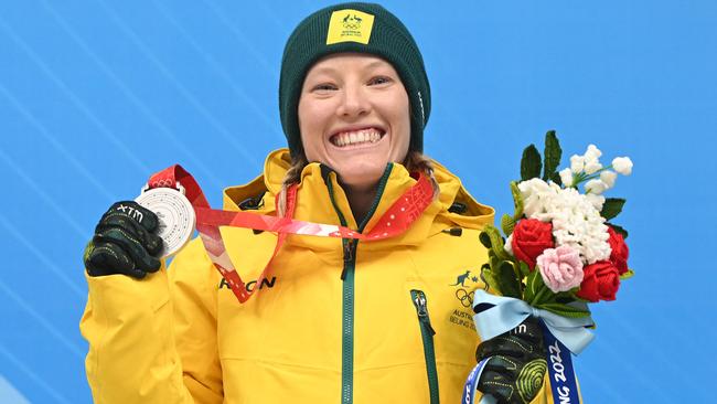 Our silver bullet celebrates on the podium with her medal in Beijing. Picture: AFP