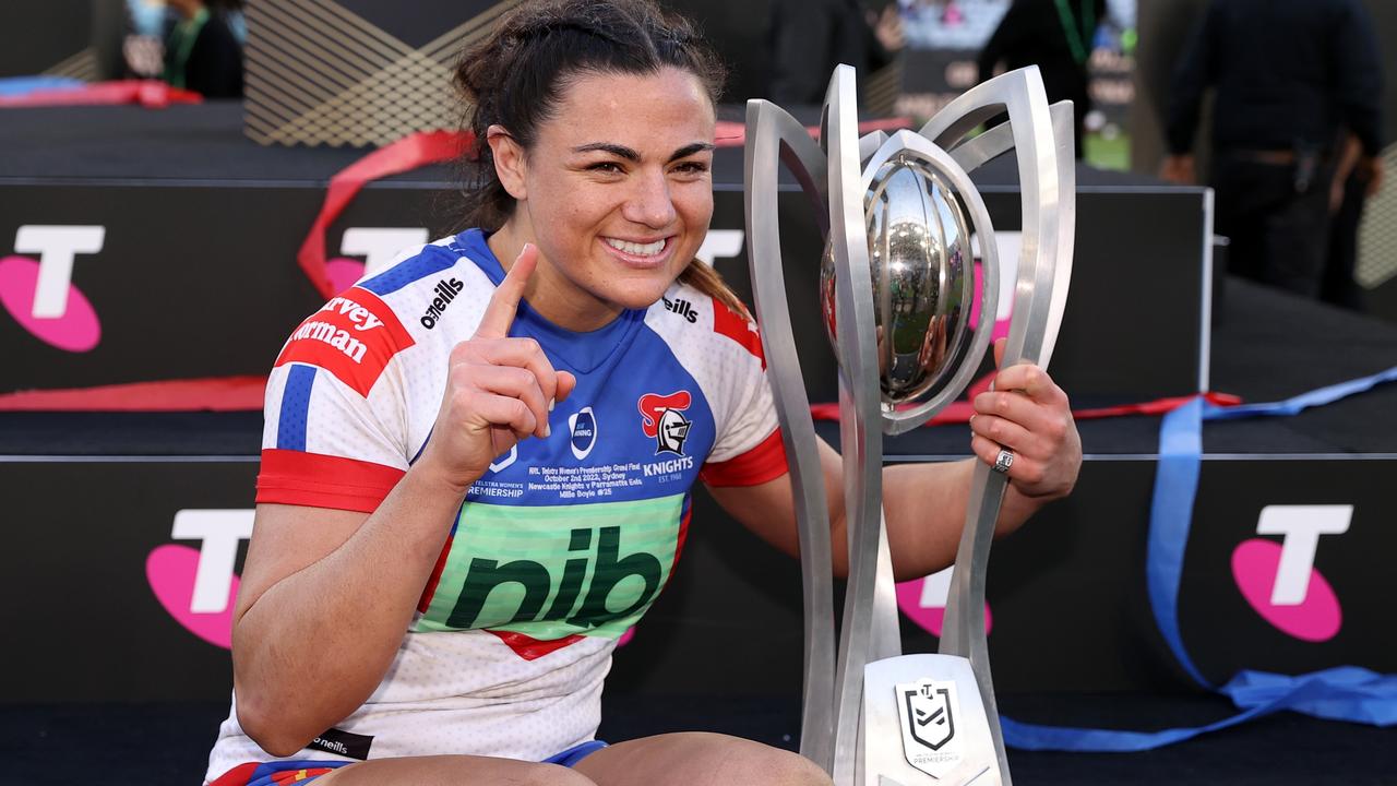 Millie Boyle of the Knights holds the NRLW Premiership Trophy. Photo by Cameron Spencer/Getty Images.