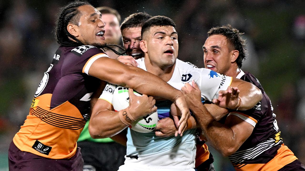 SUNSHINE COAST, AUSTRALIA - FEBRUARY 12: David Fifita of the Titans is wrapped up by the defence during the NRL Trial Match between the Brisbane Broncos and Gold Coast Titans at Sunshine Coast Stadium on February 12, 2023 in Sunshine Coast, Australia. (Photo by Bradley Kanaris/Getty Images)