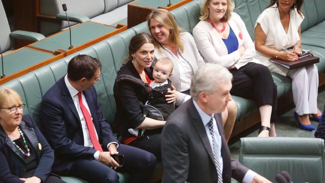 Multi-tasking with her son Charlie, then four months old, during the same-sex marriage debate last year.