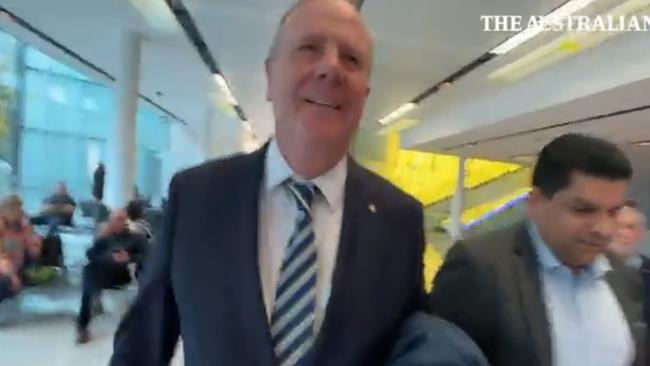 Nine chair Peter Costello has been captured on camera knocking a journalist to the ground during a scuffle at Canberra Airport. Picture: The Australian