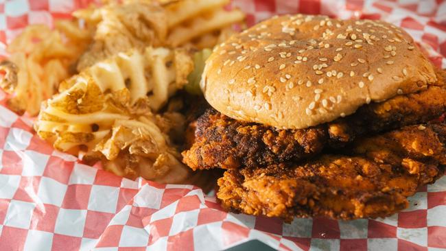 A fried-chicken sandwich with a side of waffle fries. Picture: Angela Owens / The Wall Street Journal