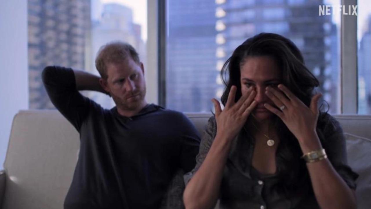 In the trailer, Meghan Markle wipes her eyes as a concerned Prince Harry looks on. Picture: Netflix