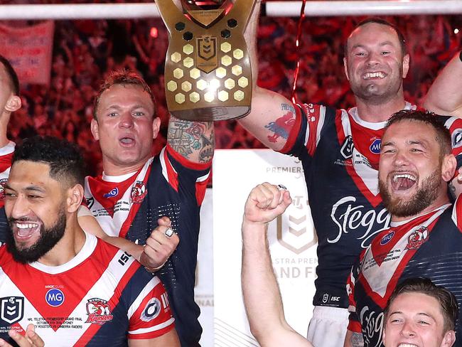 The Sydney Roosters celebrate with the Provan-Summons Trophy after defeating the Canberra Raiders in the 2019 NRL Grand Final at ANZ Stadium. Picture. Phil Hillyard