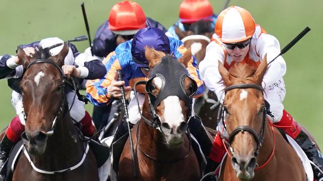 Frankie Dettori and Master of Reality close in on Il Paradiso and winner Vow and Declare in the run to the line. Picture: Michael Dodge.