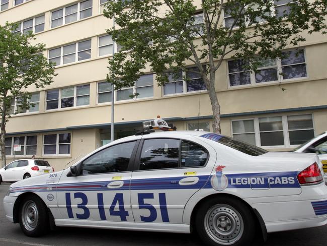 A Legion Cabs taxi drives in traffic outside of the Sydney Dental Hospital in Surry Hills, Sydney. The Daily Telegraph journalist Hildebrand put Sydney's cab drivers to the test to see if they could find their way around Sydney.