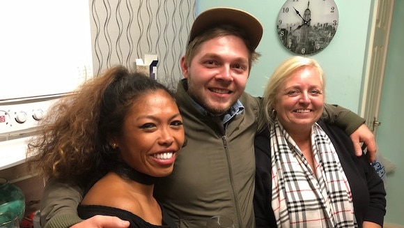 Gold Coast man Gareth Aucock before a life-threatening asthma attack in August 2018 with girlfriend Juliet (L) and mother Sue (R) by his side.