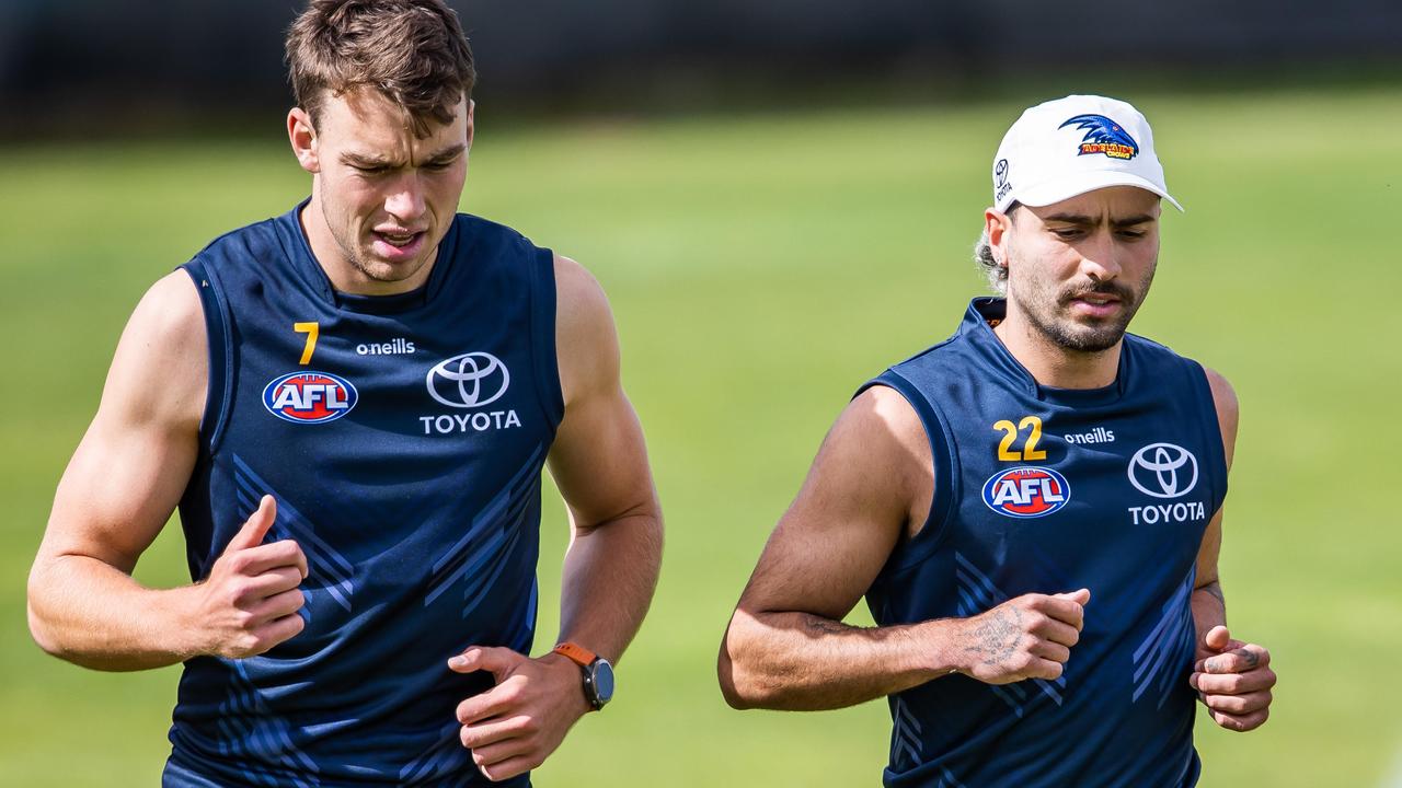 Riley Thilthorpe and Izak Rankine run laps at West Lakes. Picture: Tom Huntley