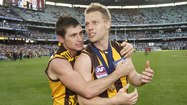 Shane Crawford and Sam Mitchell after the 2008 Grand Final.