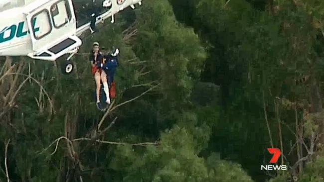 The teenager is winched to the helicopter. Picture: Channel 7 News