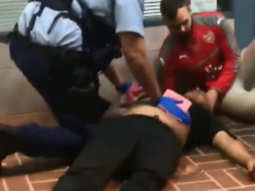 Police help stabbing victim Nick Gilio outside the Kogarah dance hall after he went to a girl’s aid. Picture: 9 News