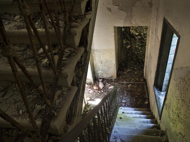 Inside the station ... stairs in the kitchen area on Poveglia Island. Picture: Ella Pellegrini