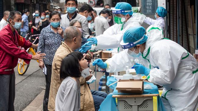 Swab samples are taken from residents to be tested for the COVID-19, in a street in Wuhan in May this year. Gostin said the concessions given to Beijing are undermining the investigation: it’s “very frustrating and extremely dangerous. We need to know the origins as there will be future coronaviruses.” Picture: AFP