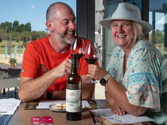 November 1, 2023: Mark and Andrea Pollard (originally from the UK but now residing in Sydney) try the Taylors Heritage Label Shiraz 2022 which has achieved a perfect score of 100 points. Pictured at Taylors new cellar door in the Clare Valley. Photo: Naomi Jellicoe