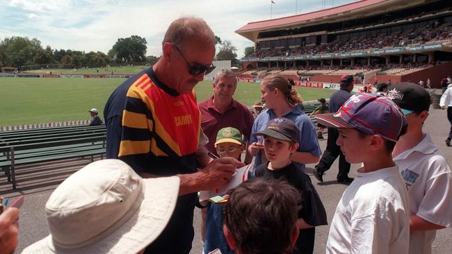 Malcolm Blight signs autographs in the crowd at a Sheffield Shield cricket match in January 1997.