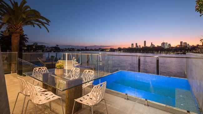 The outdoor pool area also oversees the city.