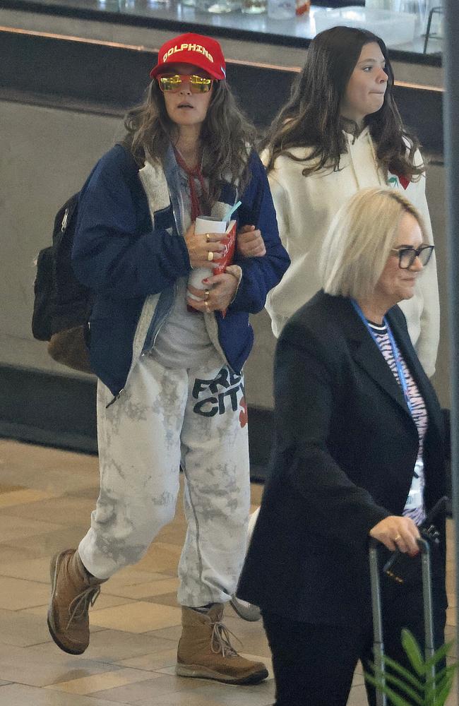 The Hollywood star was seen inside Brisbane International Airport preparing to board a flight with her two daughters Frankie and Olive. Picture: MEDIA-MODE.COM