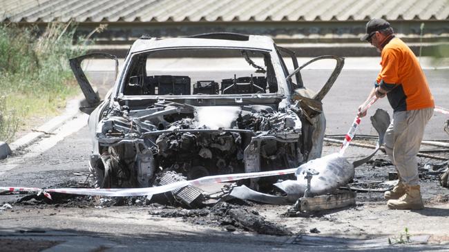 A burnt out car was found in Reservoir after the killing of The Punisher. Picture: Tony Gough